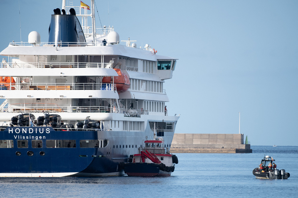Boats approach the MV Hondius after it arrived at the industrial port of Granadilla de Abona on the island of Tenerife in Spain's Canary Islands on May 10, 2026.