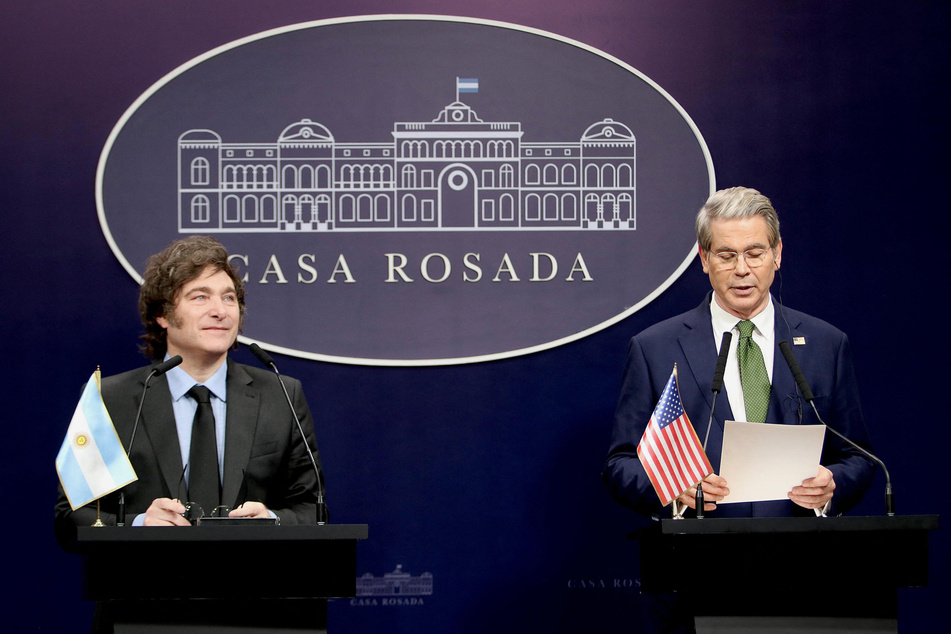 US Treasury Secretary Scott Bessent (r.) speaks next to Argentina's President Javier Milei at the Casa Rosada Presidential Palace in Buenos Aires on April 14, 2025.