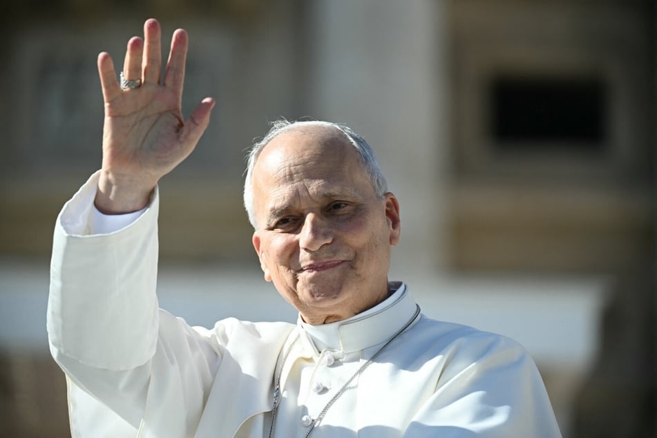 Pope Leo XIV waves to the faithful in St. Peter's Square at the Vatican on October 28, 2026. The pope cast his vote in the US midterm elections, marking the first known time a pope has voted in a political election.