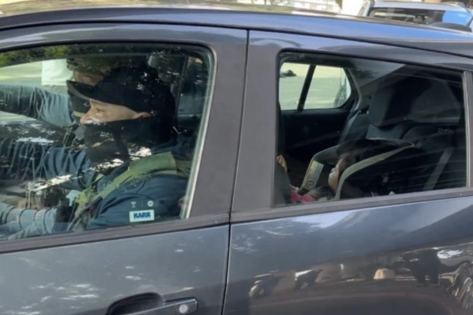 Heavily armed immigration agents drove off with a 1-year-old girl after arresting her father during a violent raid in Los Angeles.