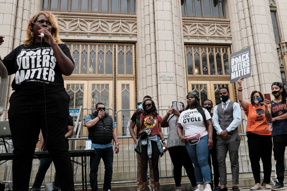 Protesters gathered outside Atlanta City Hall waving "Black Voters Matter" signs and demanding an end to voter suppression.