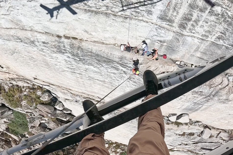 Footage from the helicopter shows the dangerous rescue operation.
