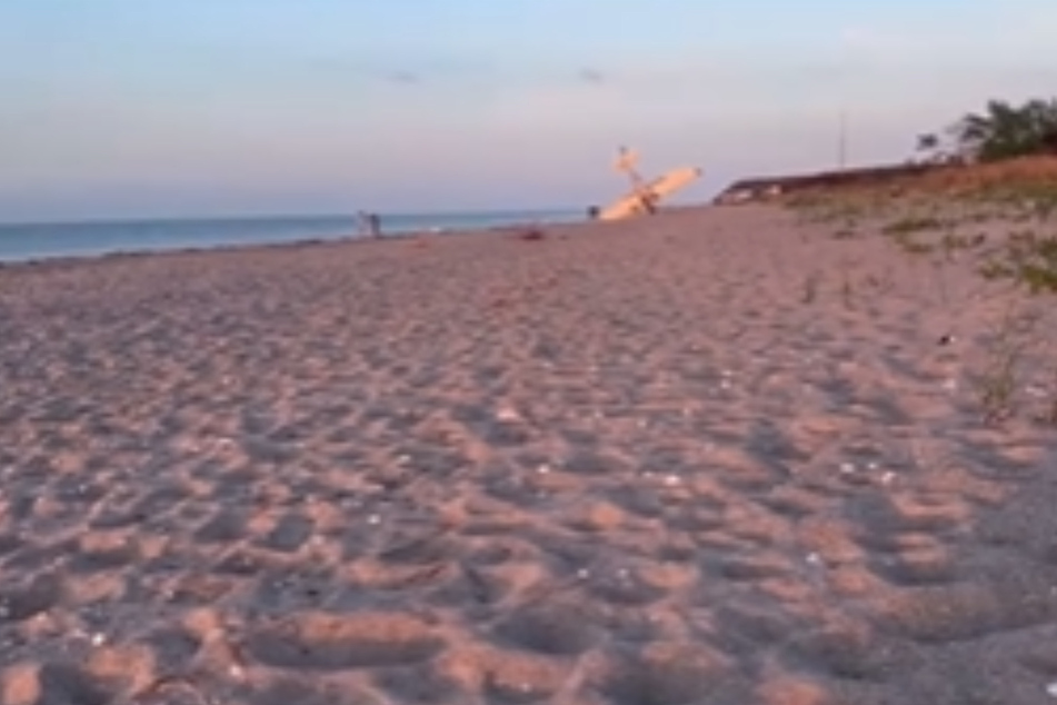 The plane tipped over in the sand afterward.