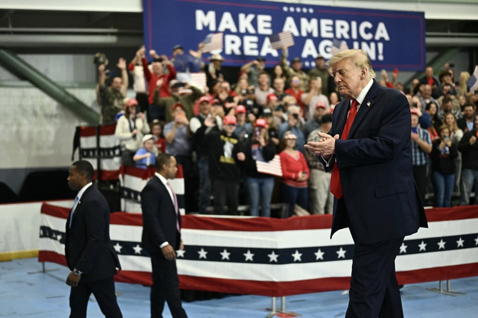 President Donald Trump claps as he walks off stage after speaking at a campaign rally in Wasilla, Alaska, on October 13, 2026. There, he told supporters Taiwan had agreed to buy 30% of the output of a planned LNG pipeline.