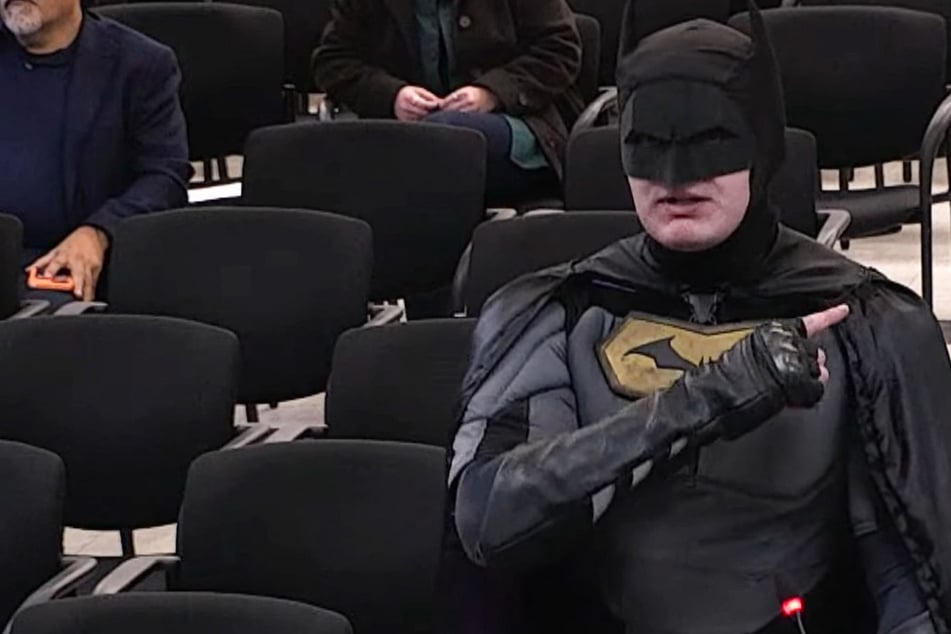 Man dressed as Batman confronts officials over ICE patrols at Super Bowl