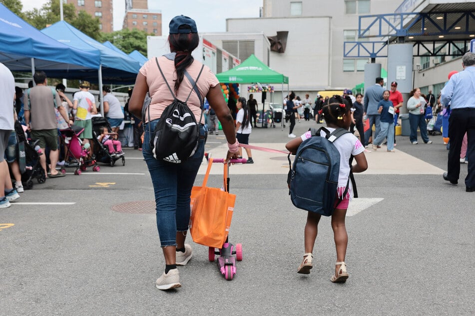 People attend a Back to School fair at NYC Health+ Hospitals/Metropolitan on August 20, 2026.