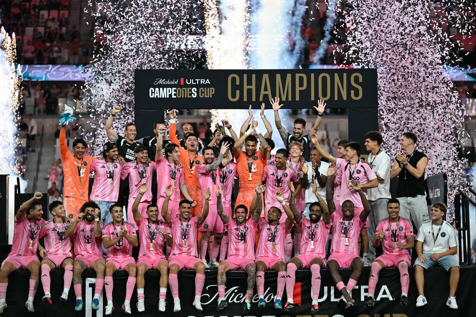 Inter Miami's Lionel Messi holds up the trophy with teammates after his team defeated Mexico's Cruz Azul in the Campeones Cup final on September 16, 2026.
