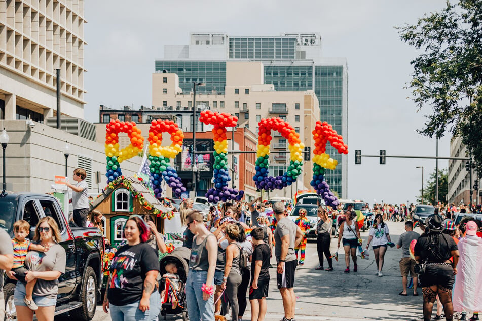 Nebraskans march and rally for LGBTQ+ rights during the Omaha Pride Parade.