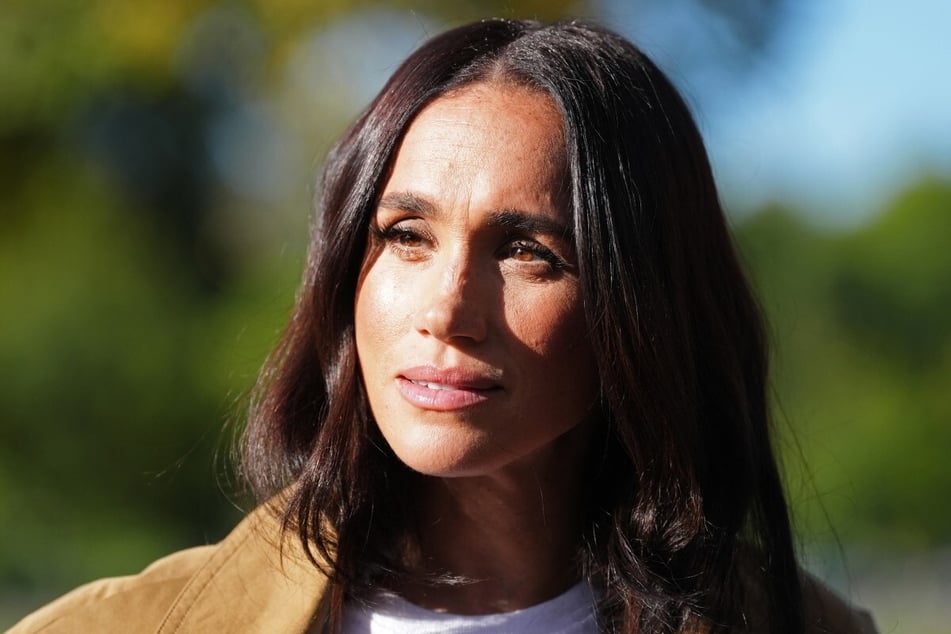 Meghan Markle partakes in the Scar Tree Walk in Melbourne in April 2026. Her estranged father, Thomas Markle, is under investigation for child abuse allegations, and his computer is currently being investigated by authorities.