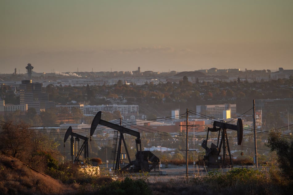 Oil pumpjacks operate in Culver City, California, on October 26, 2026. The continued burning of fossil fuels is propelling rising greenhouse gas concentrations in the earth's atmosphere.
