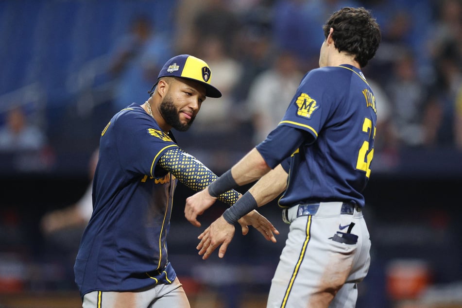 Milwaukee Brewers outfielder Jackson Chourio (l.) celebrates with designated hitter Christian Yelich (r.) after defeating the Tampa Bay Rays in game three of the 2026 World Series.