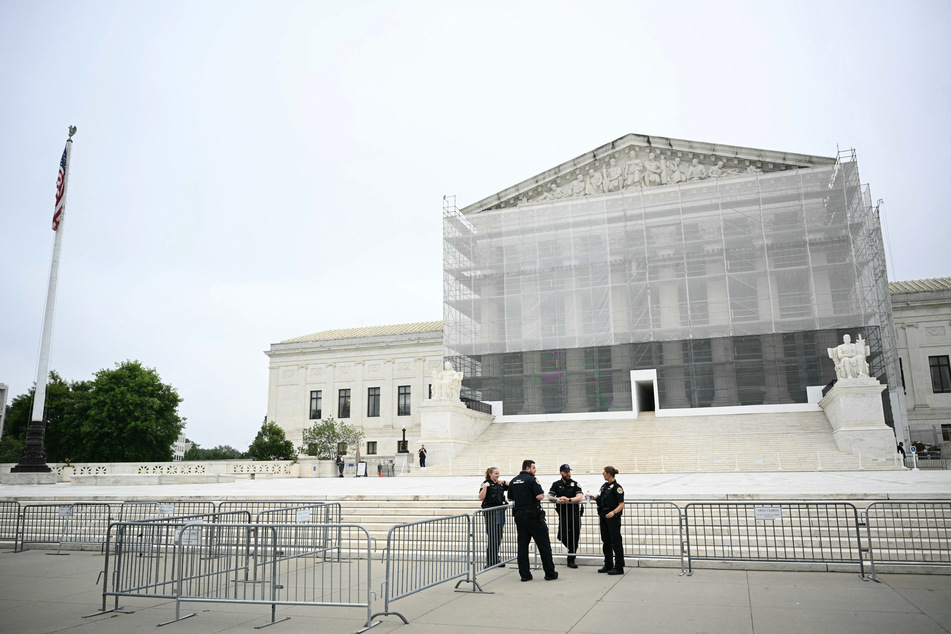 US Supreme Court Police officers stand outside the Supreme Court in Washington, DC, on Friday.