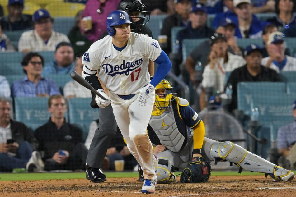 Los Angeles Dodgers pitcher Shohei Ohtani runs after hitting a single against the Milwaukee Brewers during the eighth inning in game three of the NLCS.