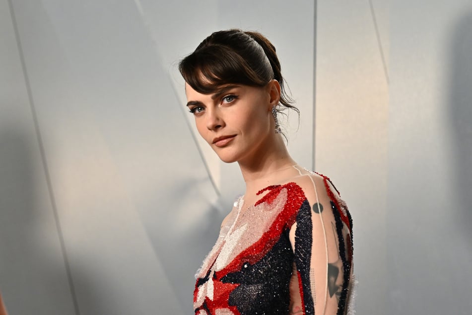 It looks like Cara Delevingne is swapping the camera for a microphone!