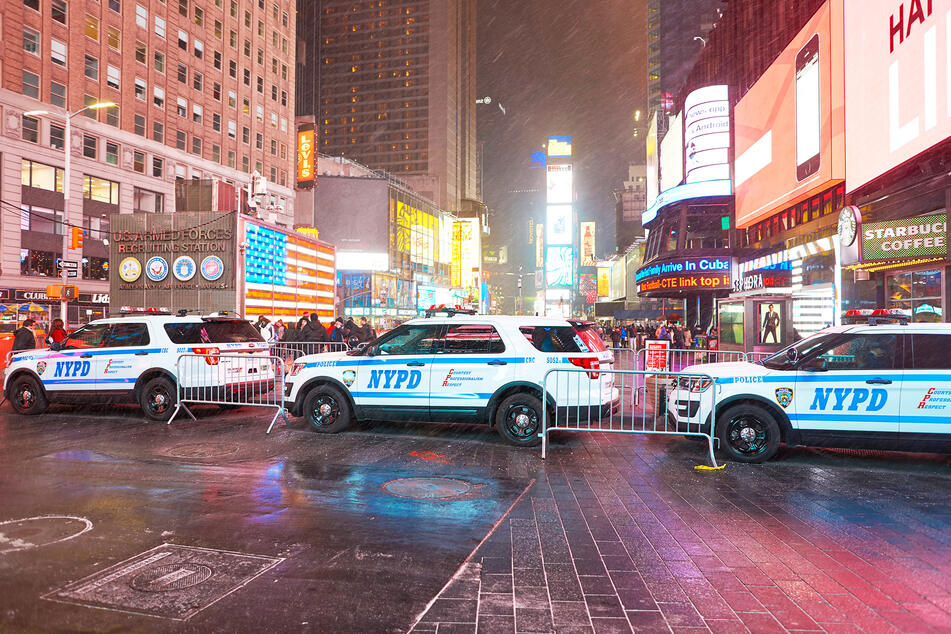 Numerous patrol cars secure Times Square in New York (stock image).