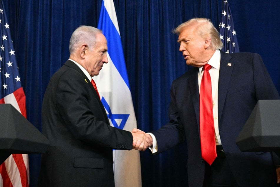 President Donald Trump (r.) and Israeli Prime Minister Benjamin Netanyahu shake hands during a press conference in Palm Beach, Florida, on December 29, 2025. President Trump recently suggested he may intervene after Netanyahu claimed his country's election was "stolen."