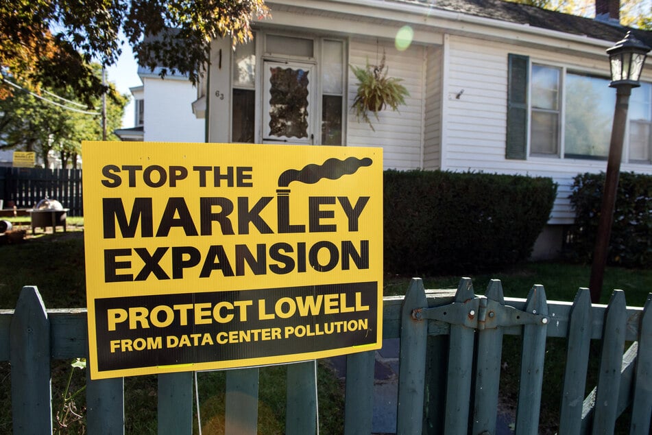 A sign expressing opposition to the expansion of the Markley Lowell Data Center is displayed outside a home in Lowell, Massachusetts, on October 15, 2026.