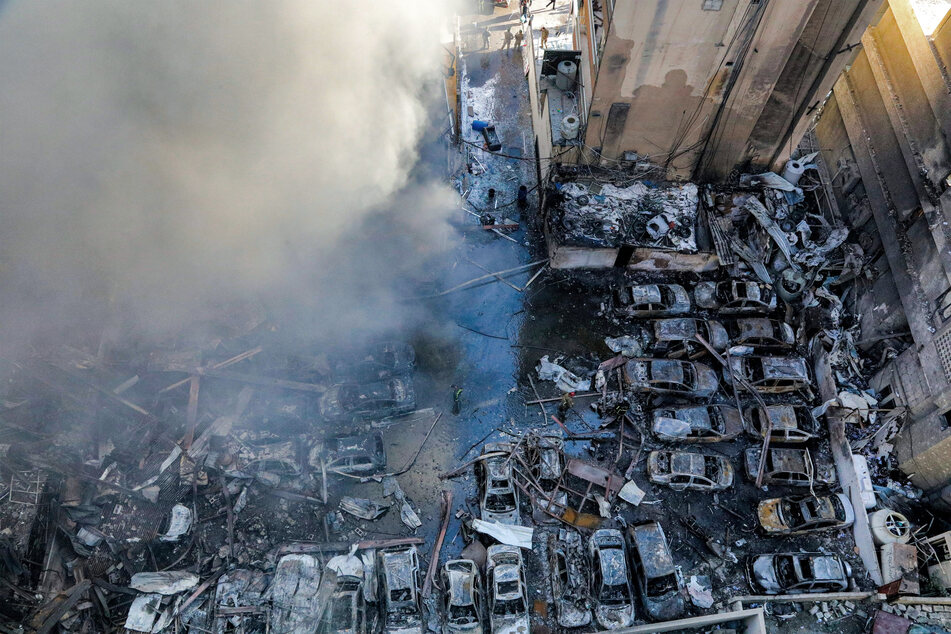 Firefighters attempt to extinguish a fire following an Israeli strike at the Corniche al-Mazraa neighborhood of Beirut on April 8, 2026.
