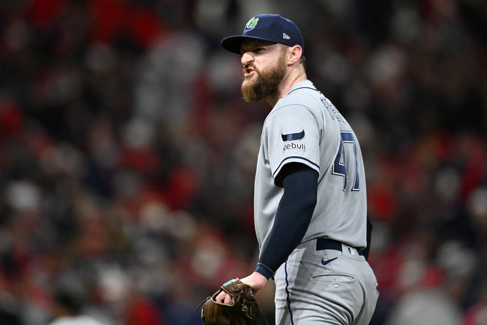 Tampa Bay Rays pitcher Bryan Baker celebrates a win against the Cleveland Guardians in game five of the ALCS.