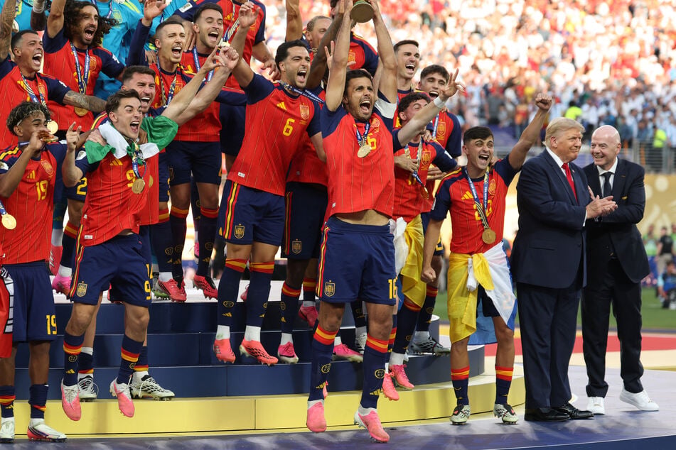 Trump laps up the spotlight on stage as Spain celebrates World Cup victory