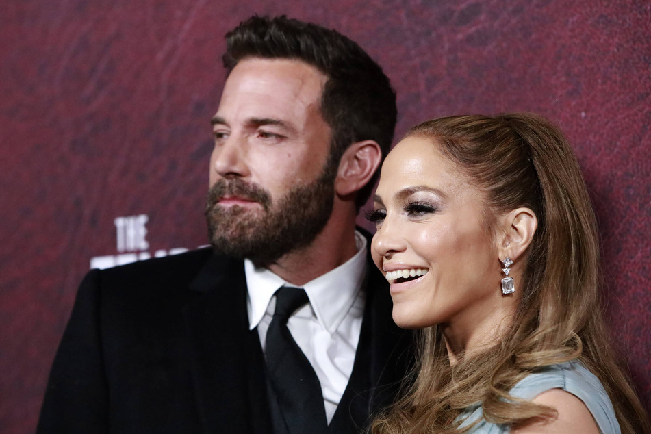 Ben Affleck (l.) suited up to work in his favorite restaurant in a new Dunkin' ad alongside wife Jennifer Lopez.