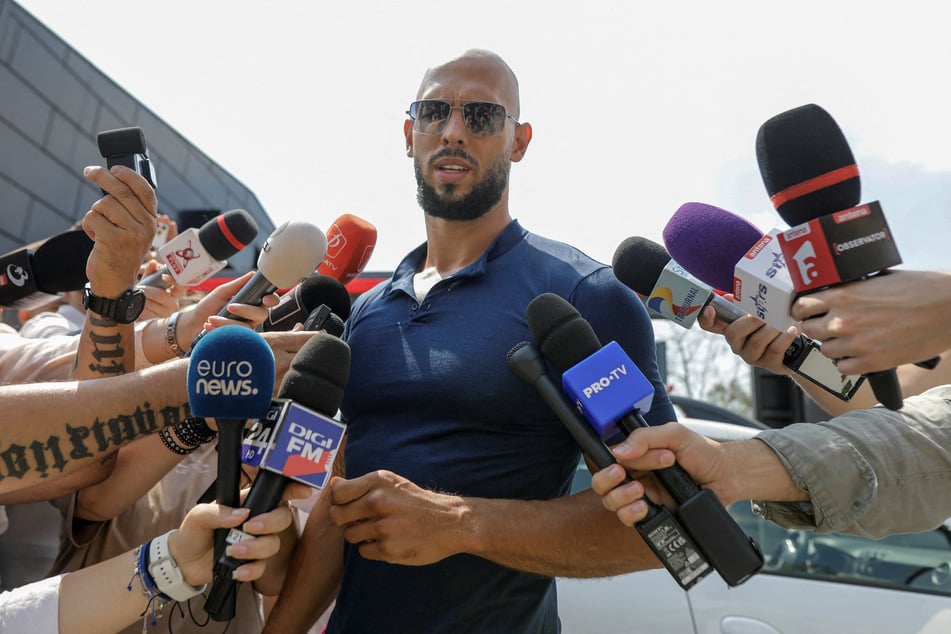 Andrew Tate delivers a press statement outside his home in Romania following his release from house arrest.