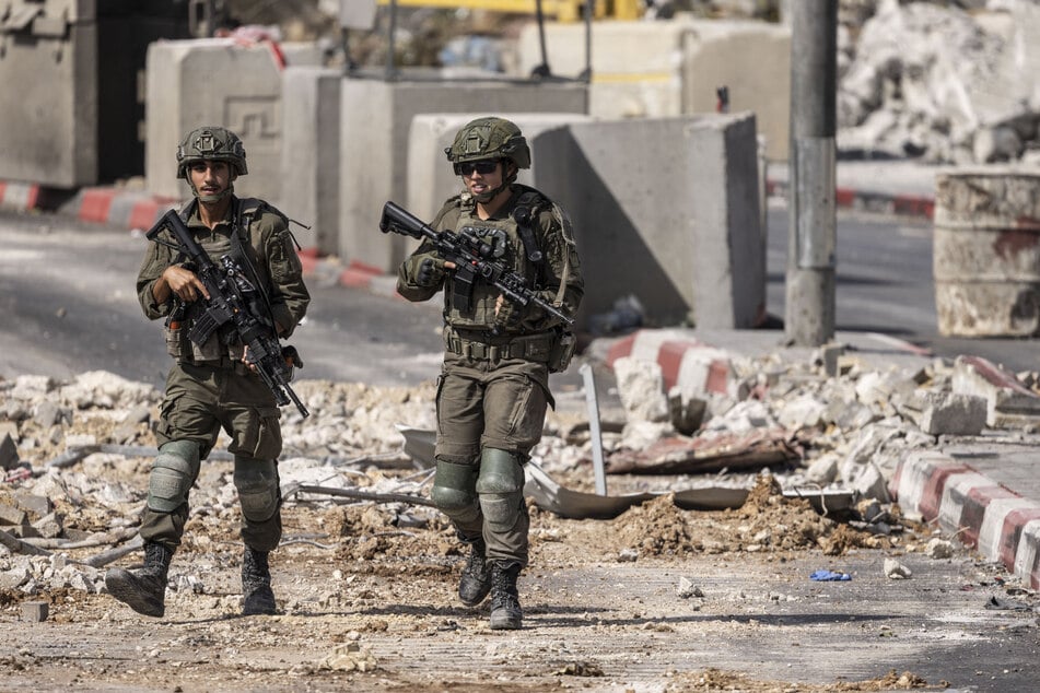 Israeli soldiers patrol at the northern checkpoint in Hebron, in the occupied West Bank, on October 24, 2026.