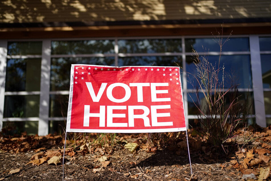 A "Vote Here" sign is displayed outside the Walter Reed Recreation Center on Election Day in Arlington, Virginia.