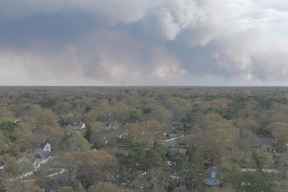 A drone view shows smoke rising from a wildfire in Pine Beach, New Jersey, on April, 22, 2025.
