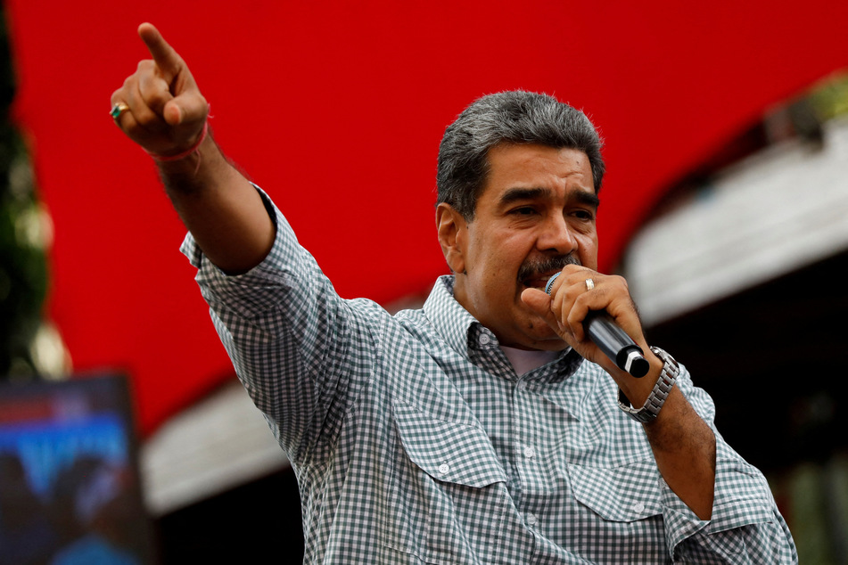 Venezuelan President Nicolas Maduro delivers a speech during a rally to celebrate the results of the July presidential election, in Caracas on August 28, 2024.