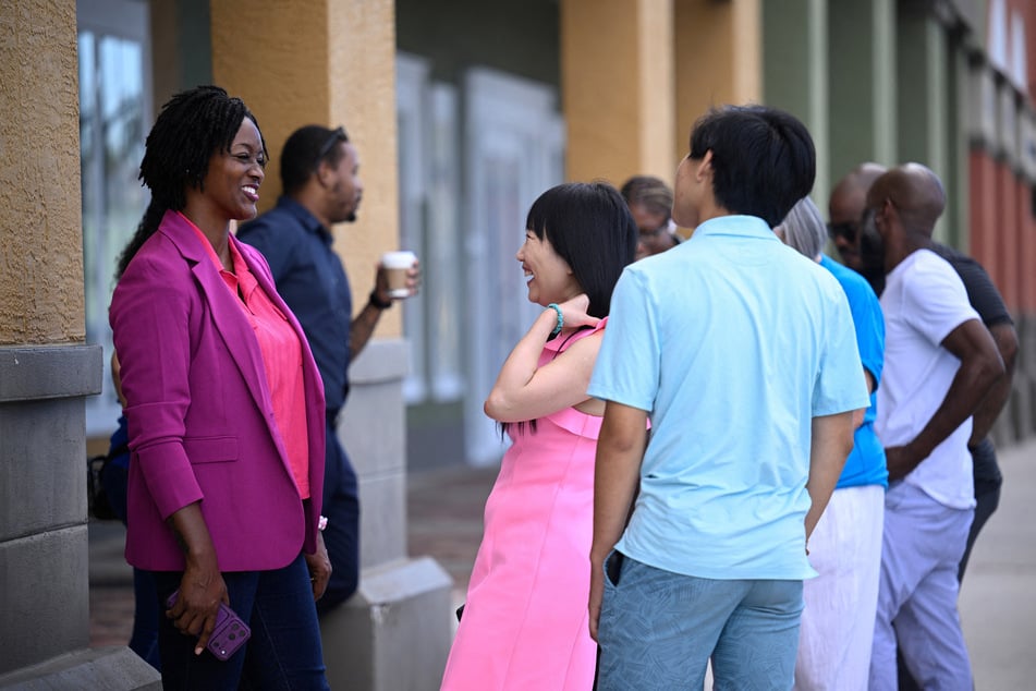 Angie Nixon chats with supporters in Orlando, Florida, on September 5, 2026. She has put forward a platform calling for Medicare For All, universal childcare, and a $25 minimum wage.