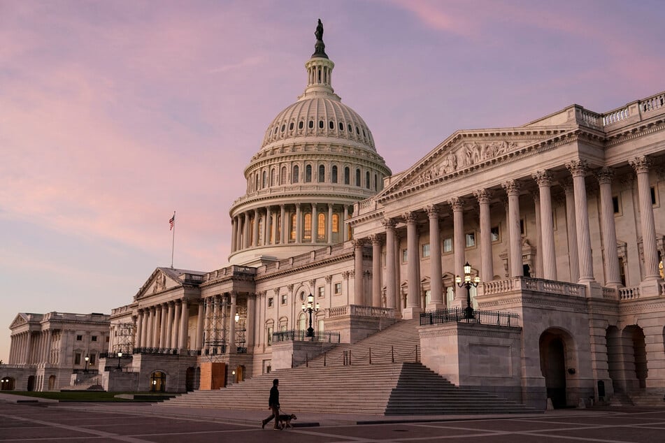 The sun rises at the US Capitol in Washington DC on the morning of the 2022 midterm elections.