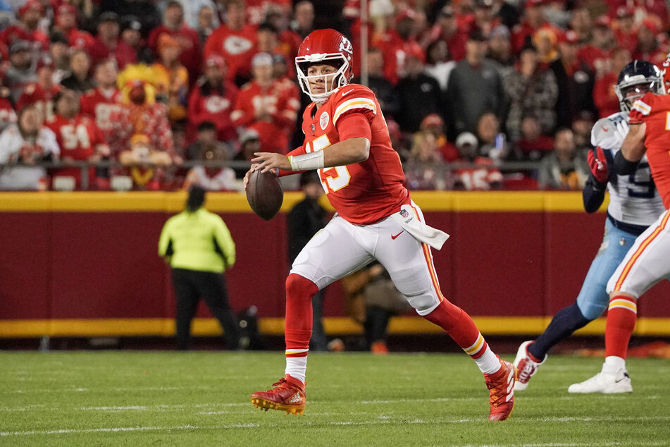 Kansas City Chiefs quarterback Patrick Mahomes scrambles against the Tennessee Titans during the first half at GEHA Field at Arrowhead Stadium.
