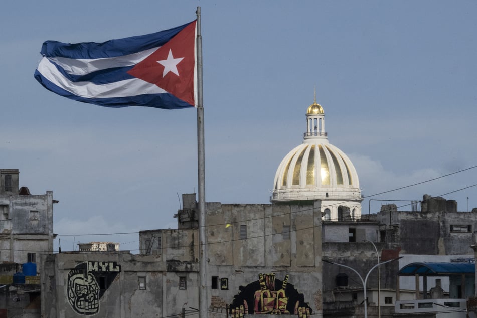The Cuban flag flutters along the Malecon in Havana, with the Capitol seen in the background, on June 17, 2026.