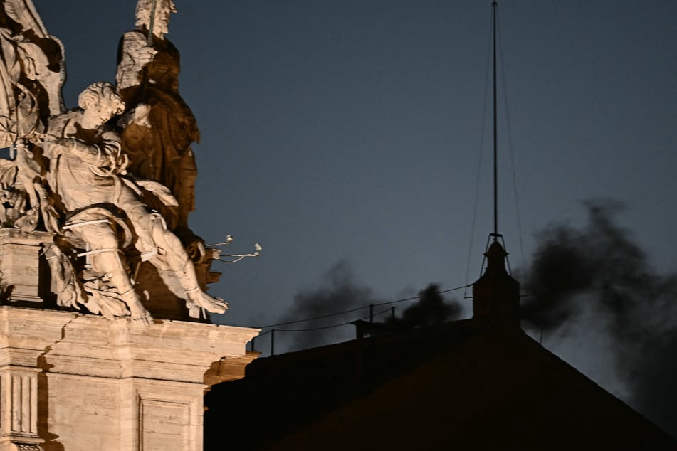 Smoke emerges from Sistine Chapel as first day of conclave wraps up