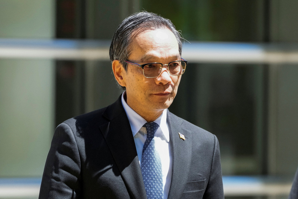Lu Jianwang, a US citizen charged with conspiring to act as an agent of the Chinese government by helping set up a Chinese "secret police station," exits Brooklyn Federal court during his trial in New York City on May 12, 2026.