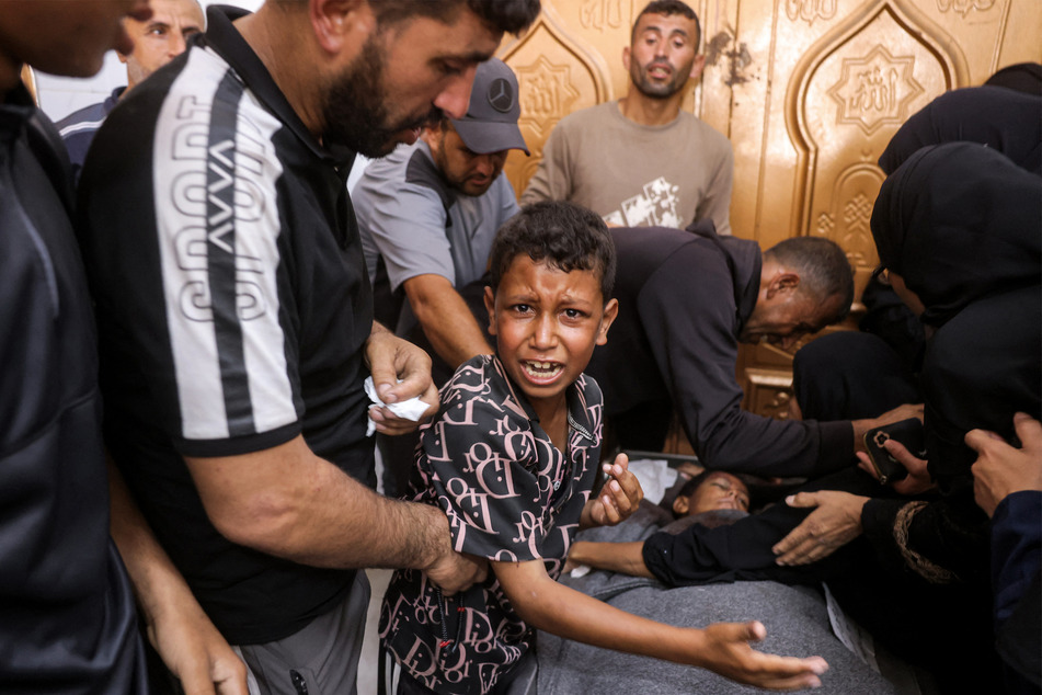 A Palestinian boy mourns his 12-year-old brother after he was killed by Israel, at Nasser Medical Complex in Khan Younis in the southern Gaza Strip on June 24, 2026.
