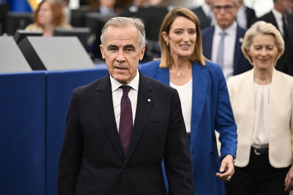 Canadian Prime Minister Mark Carney (l), EU Parliament President Roberta Metsola (c), and European Commission President Ursula von der Leyen (r) arrive at the EU's State of the Union address on Wednesday.