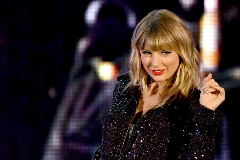 Taylor Swift will drop four previously unreleased tracks at midnight on Friday.