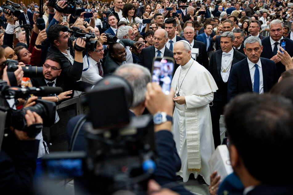 Pope Leo XIV urges release of journalists and cracks joke in English at first press conference