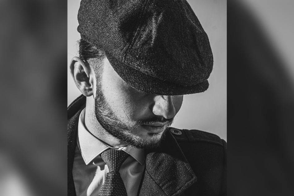 Flat caps give off an old-fashioned look, but they can easily be modernized with statement pieces.