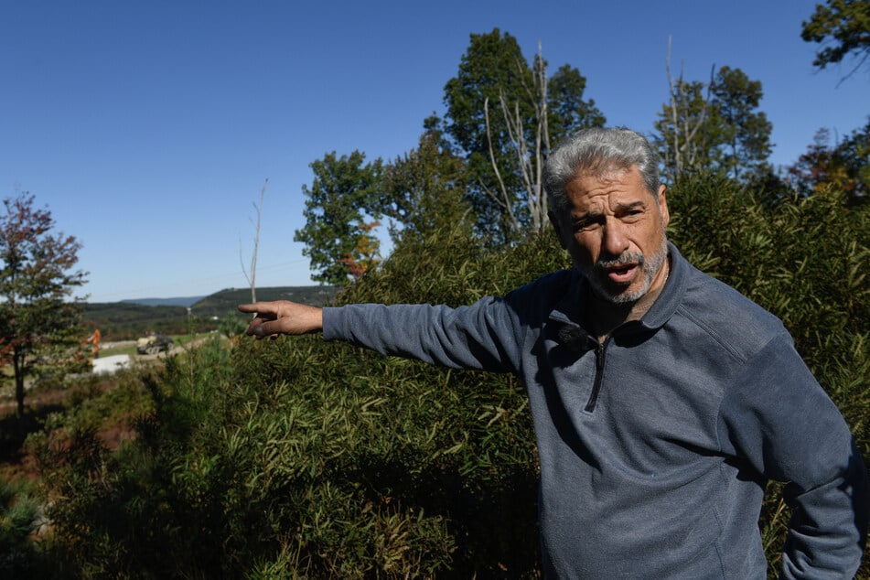 Ed Negra, a resident of the Eagle Rock Resort community, speaks about the proposed data center development called "Project Hazelnut" in Hazle Township, Pennsylvania, on October 6, 2026.