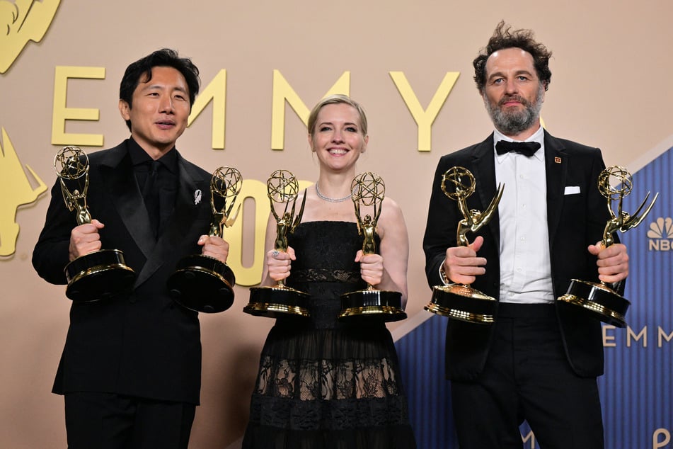 (From l. to r.) Hiro Murai, Katie Dippold, and Matthew Rhys celebrate wins for Widow's Bay at the 78th Primetime Emmy Awards in Los Angeles on September 14, 2026. The TV award ceremony is now making the jump to streaming.
