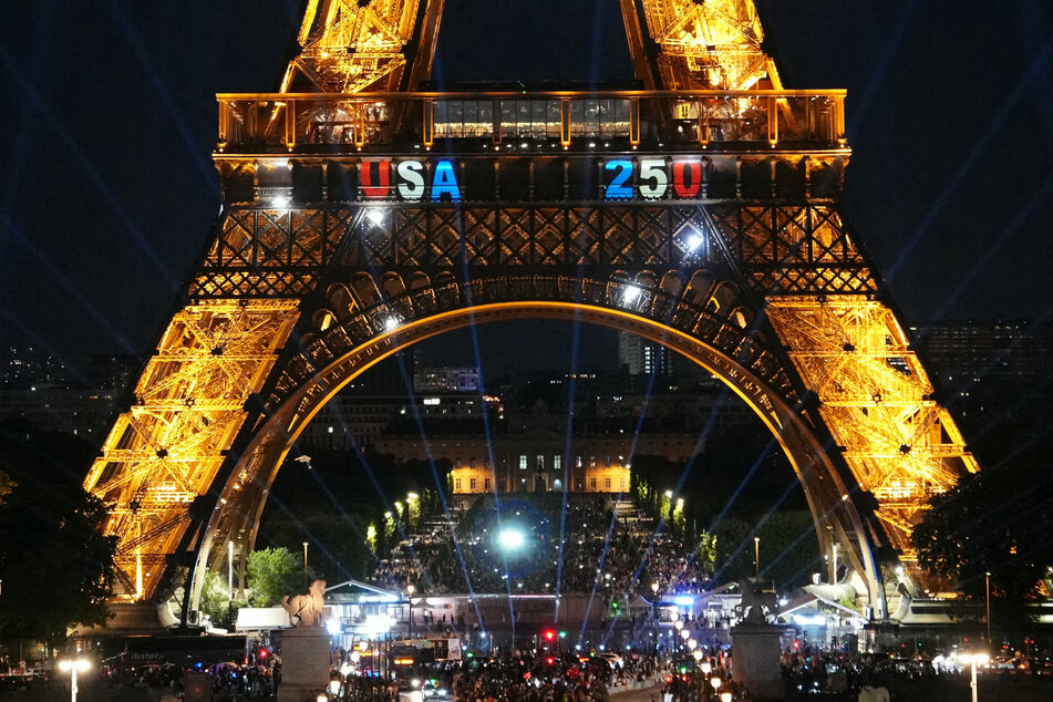 Amid ongoing celebrations marking the US' 250th anniversary, a man climbed the Eiffel Tower on Saturday and unveiled the stars and stripes.