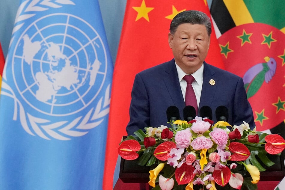 China's Xi doubles down on "reunification" threats to Taiwan in chilling message