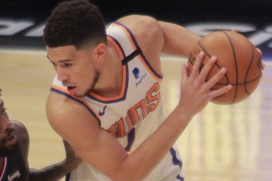 Devin Booker had his first career playoff triple-double as the Suns took game one on Sunday afternoon