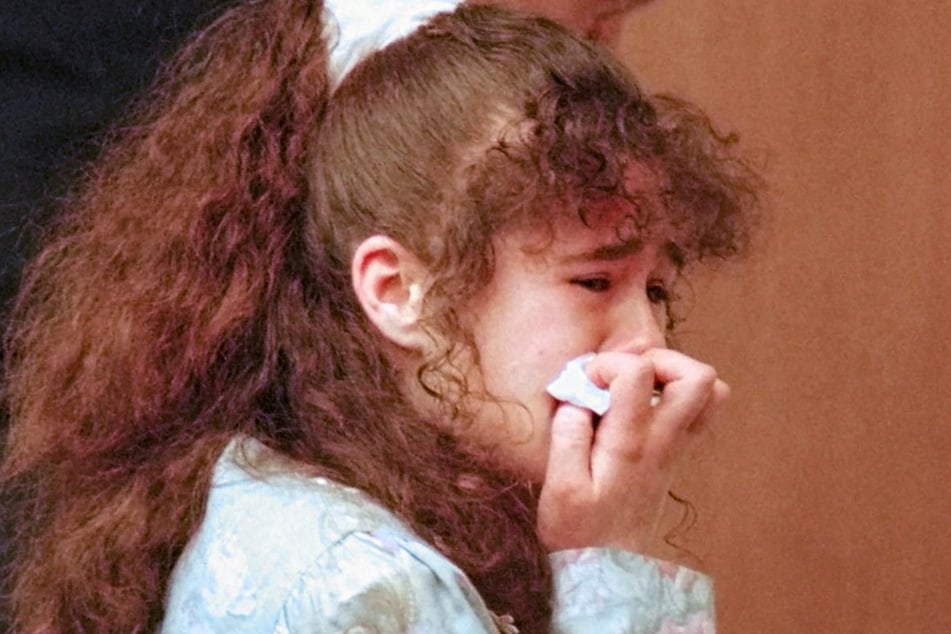 A picture taken on March 30, 1996, shows Christa Pike being escorted from Knox County Criminal Court  after being sentenced to death. Her botched execution has sparked global cries for an end to the death penalty.