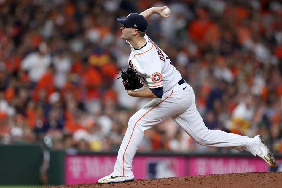 Astros pitcher Jake Odorizzi carried off the mound after scary fall