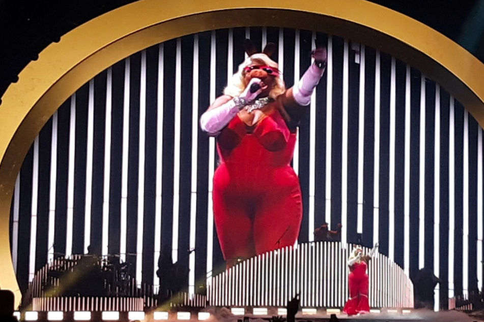 Lizzo performing in Denver dressed as Miss Piggy.