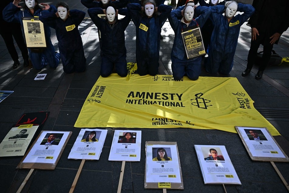Activists from Amnesty International demonstrating in support of the Uyghurs in France, in May 2024 during a diplomatic visit from China. The French company Decathlon was accused of buying textiles made with forced Uyghur labor.